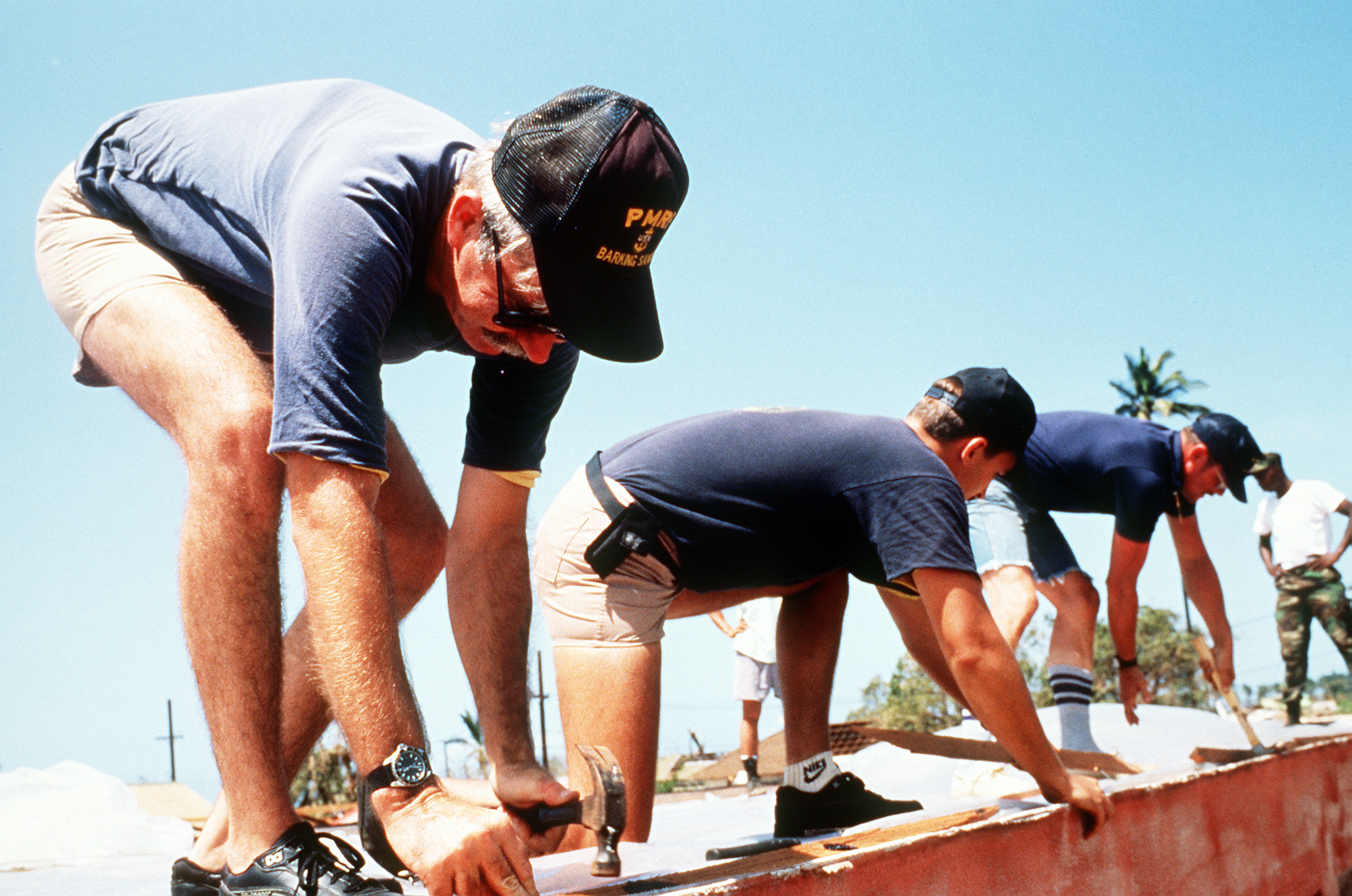 Navy volunteers repair a building in Waimea.
